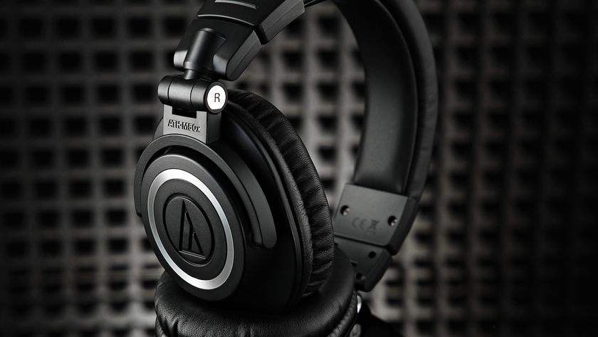 A pair of Audio-Technica ATH-M50x headphones in a studio