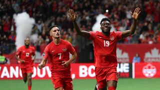 Canada's Alphonso Davis (no. 19) celebrates after scoring a goal