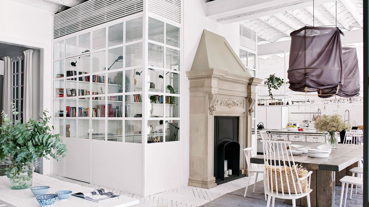 a large enclosed glass divide in a kitchen