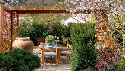 a backyard with corten privacy screens