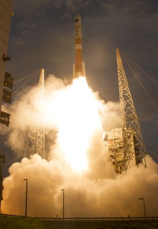 The U.S. military's Wideband Global SATCOM 7 satellite launches into orbit atop a United Launch Alliance Delta IV rocket on July 23, 2015 during an evening launch from the Cape Canaveral Air Force Station in Florida.