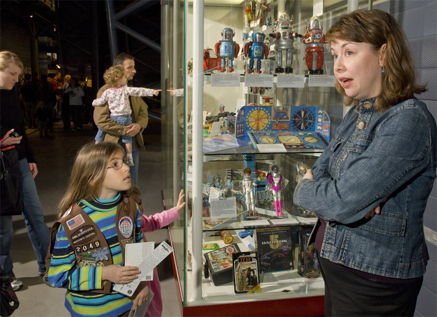 Space History curator Margaret Weitekamp talks to a young visitor at the Women in Aviation &amp; Space Family Day. Celebration of Women&#039;s History Month, March 8, 2008 at the Smithsonain National Air and Space Museum Steven F. Udvar-Hazy Center.