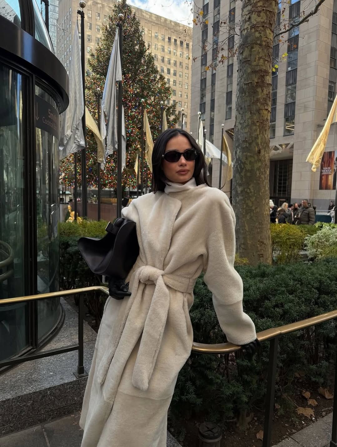 Kelsey Merritt wearing a coat from Almada Label