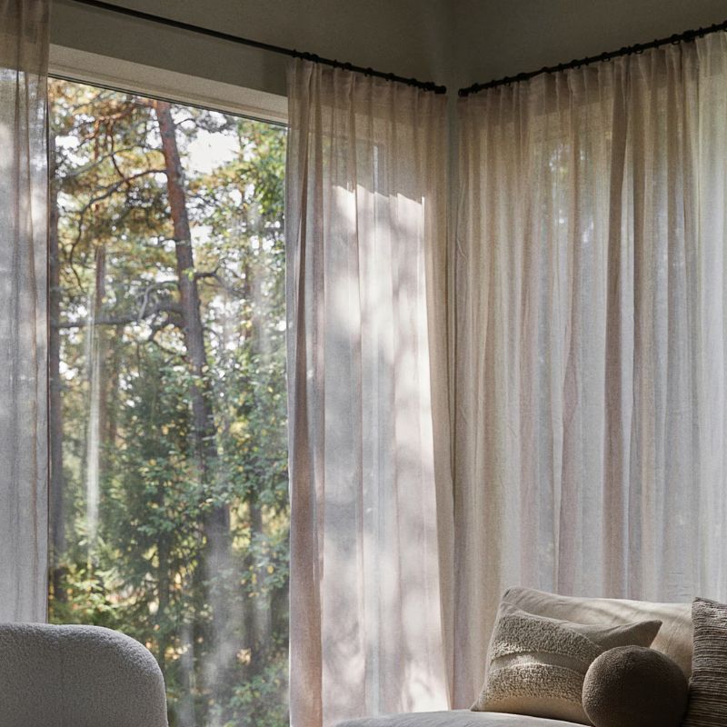 linen curtains in front of large windows