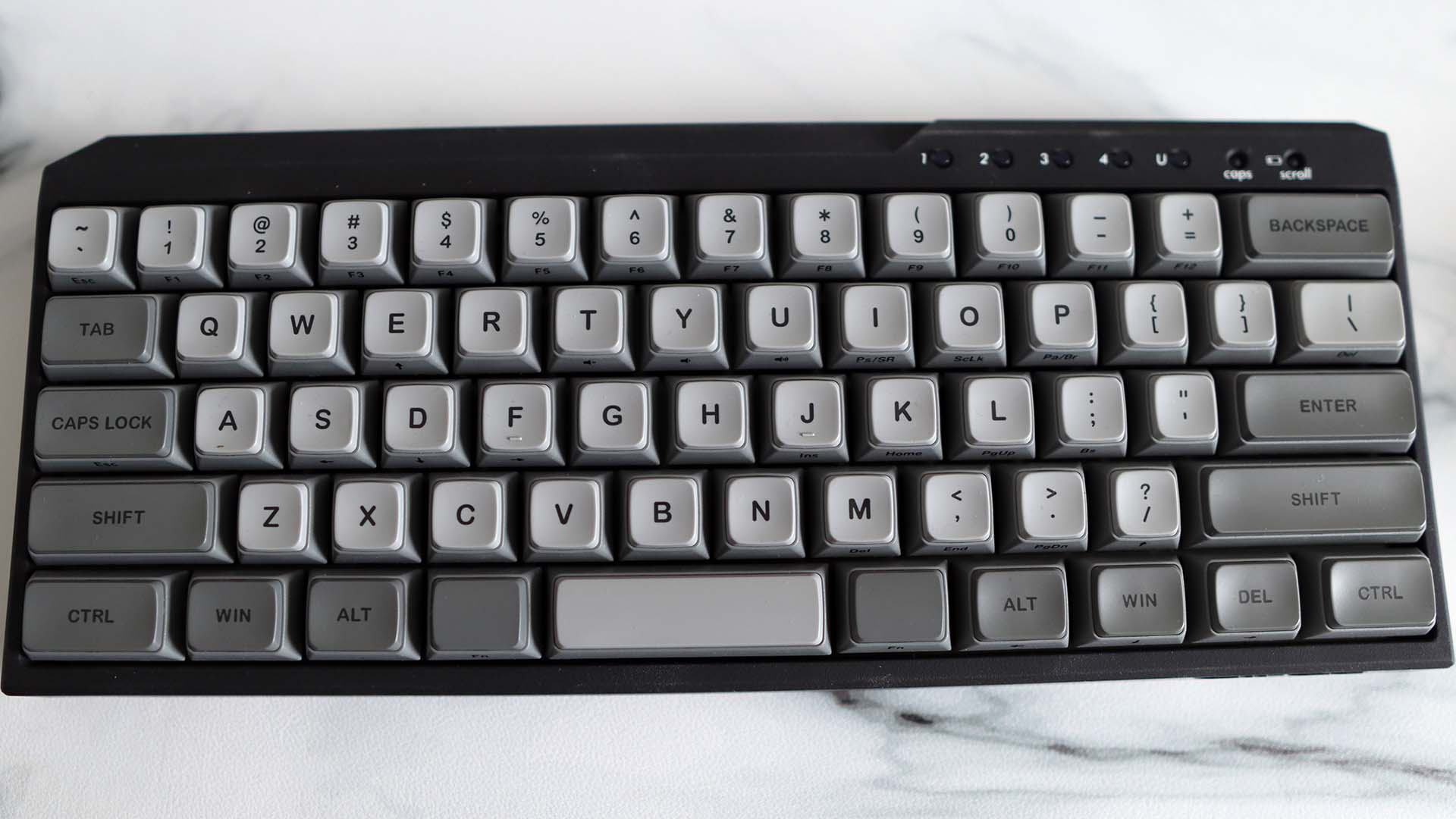 A Filco Majestouch MINILA-R gaming keyboard on a marble effect desk