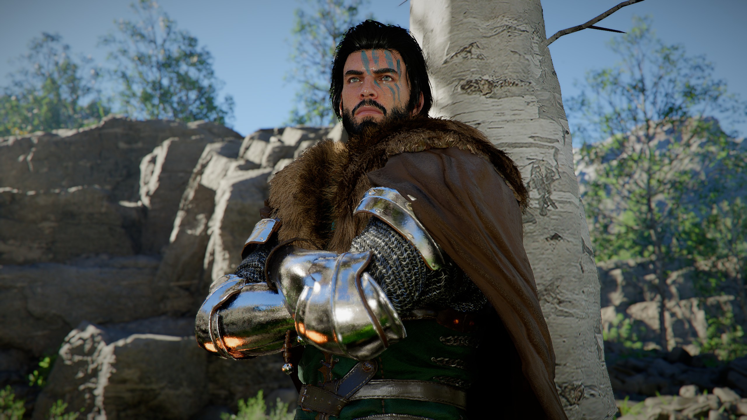 Kliff leaning against a tree.