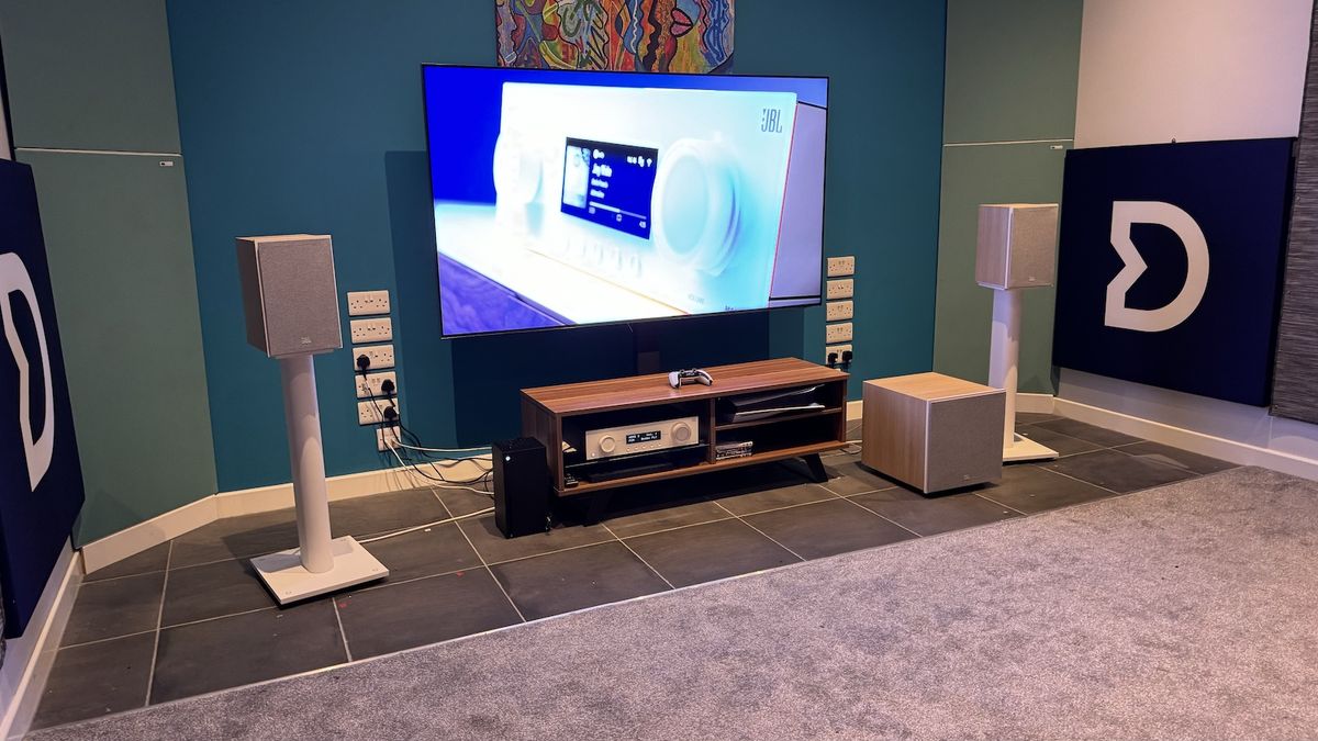 The JBL MA310 amplifier, Stage 250B standmount speakers and Stage 200P subwoofer photographed as a system with a TV in a dedicated listening room