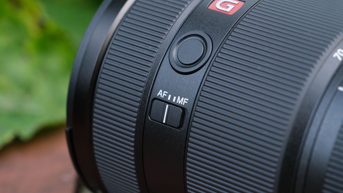 Close-up of the AF MF switch on a Sony FE 28-70mm f/2 GM lens
