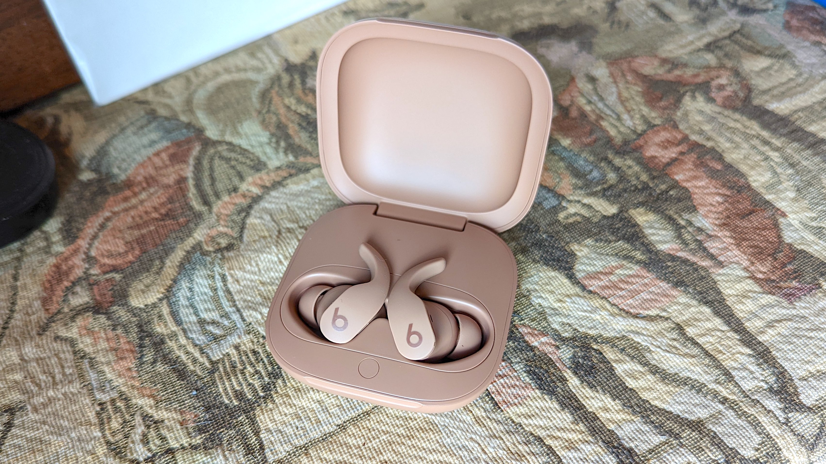The dune colored Beats Fit Pro wireless earbuds from the Kim Kardashian Collection