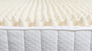 A close up of the Turmerry Egg Crate Mattress Topper: