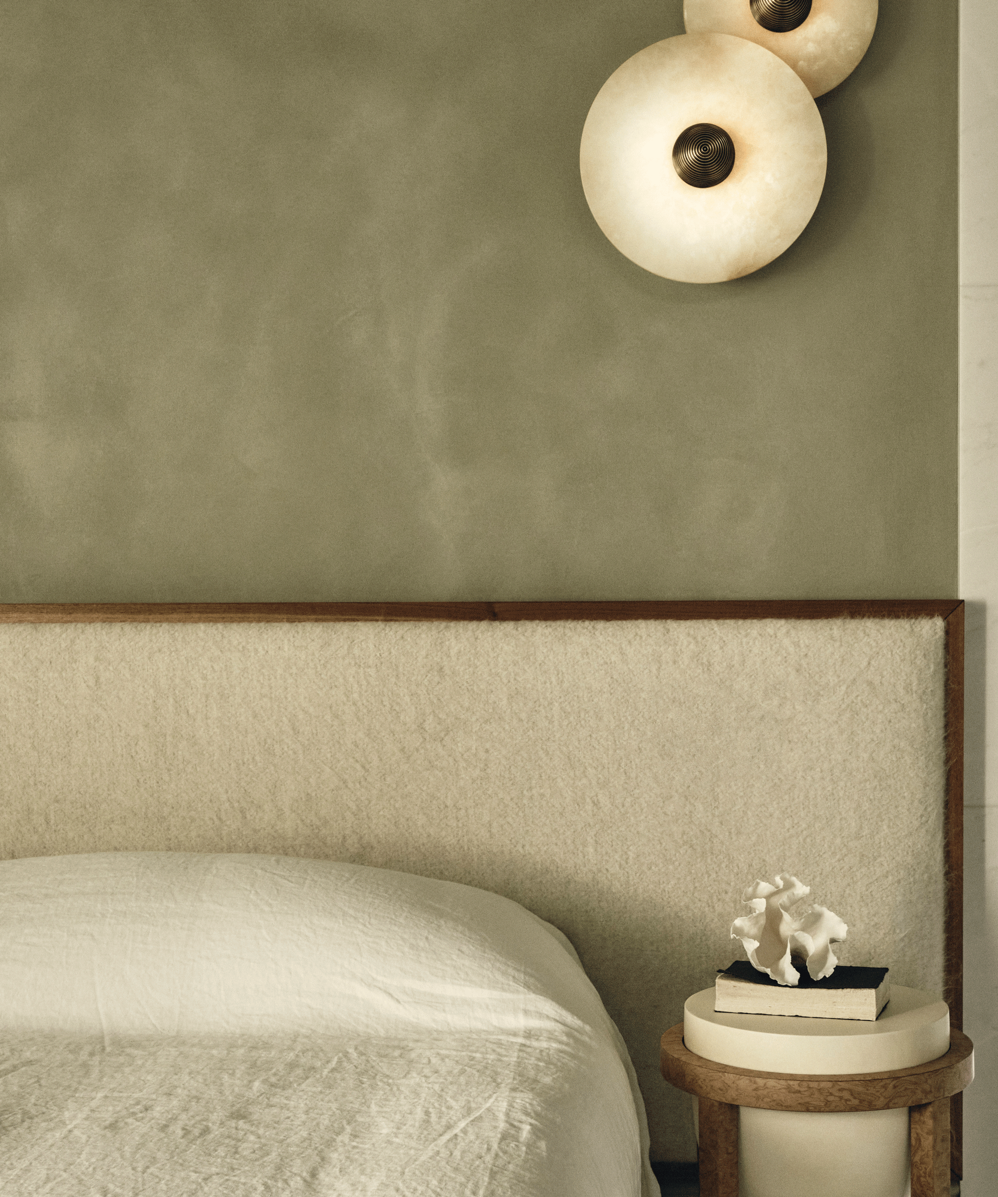 white upholstered headboard in bedroom