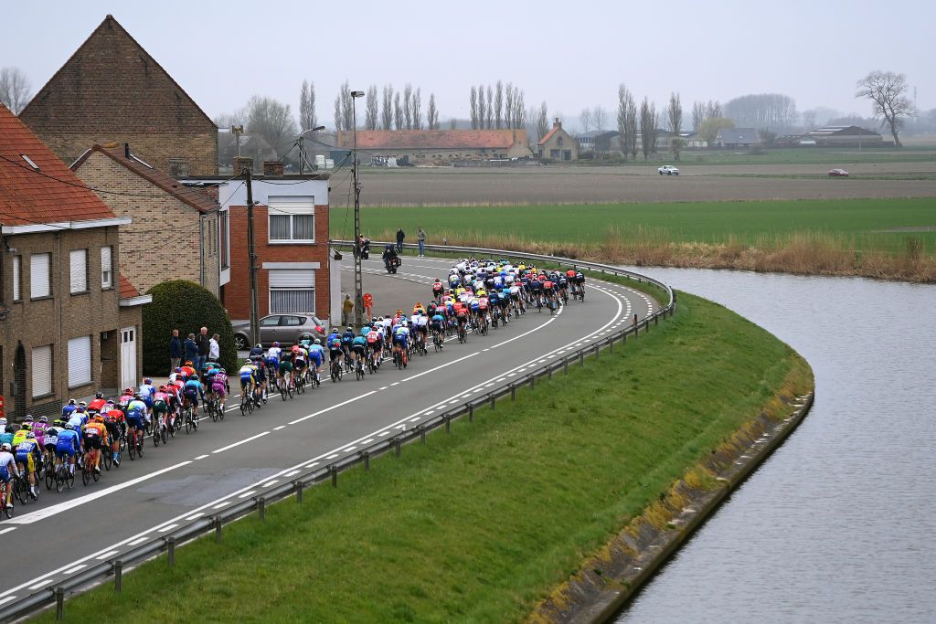 WEVELGEM BELGIUM MARCH 27 A general view of the Peloton passing through De Moeren during the 84th GentWevelgem in Flanders Fields 2022 Mens Elite a 2488km one day race from Ypres to Wevelgem GWE22 WorldTour on March 27 2022 in Wevelgem Belgium Photo by Tim de WaeleGetty Images