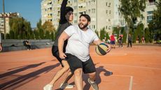Man exercising with friends playing basketball for 30 minutes