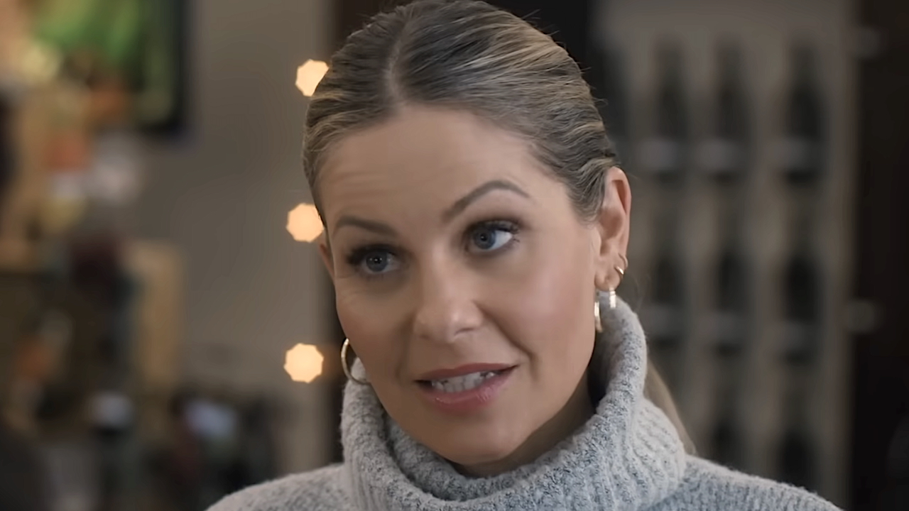 Ainsley McGregor in grey turtleneck sweater in A Case for the Winemaker