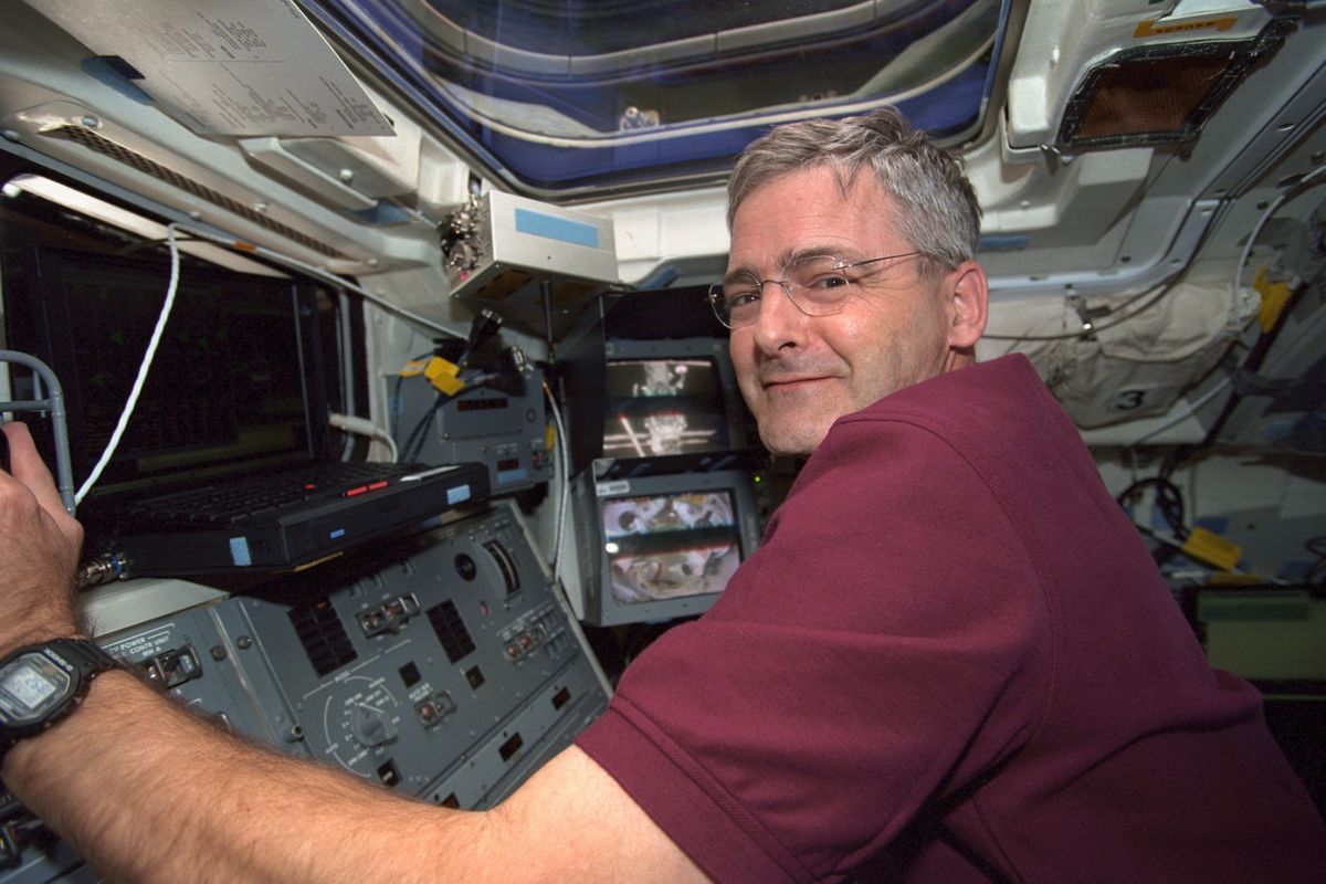 Marc Garneau at Controls of Canadian Robotic Arm