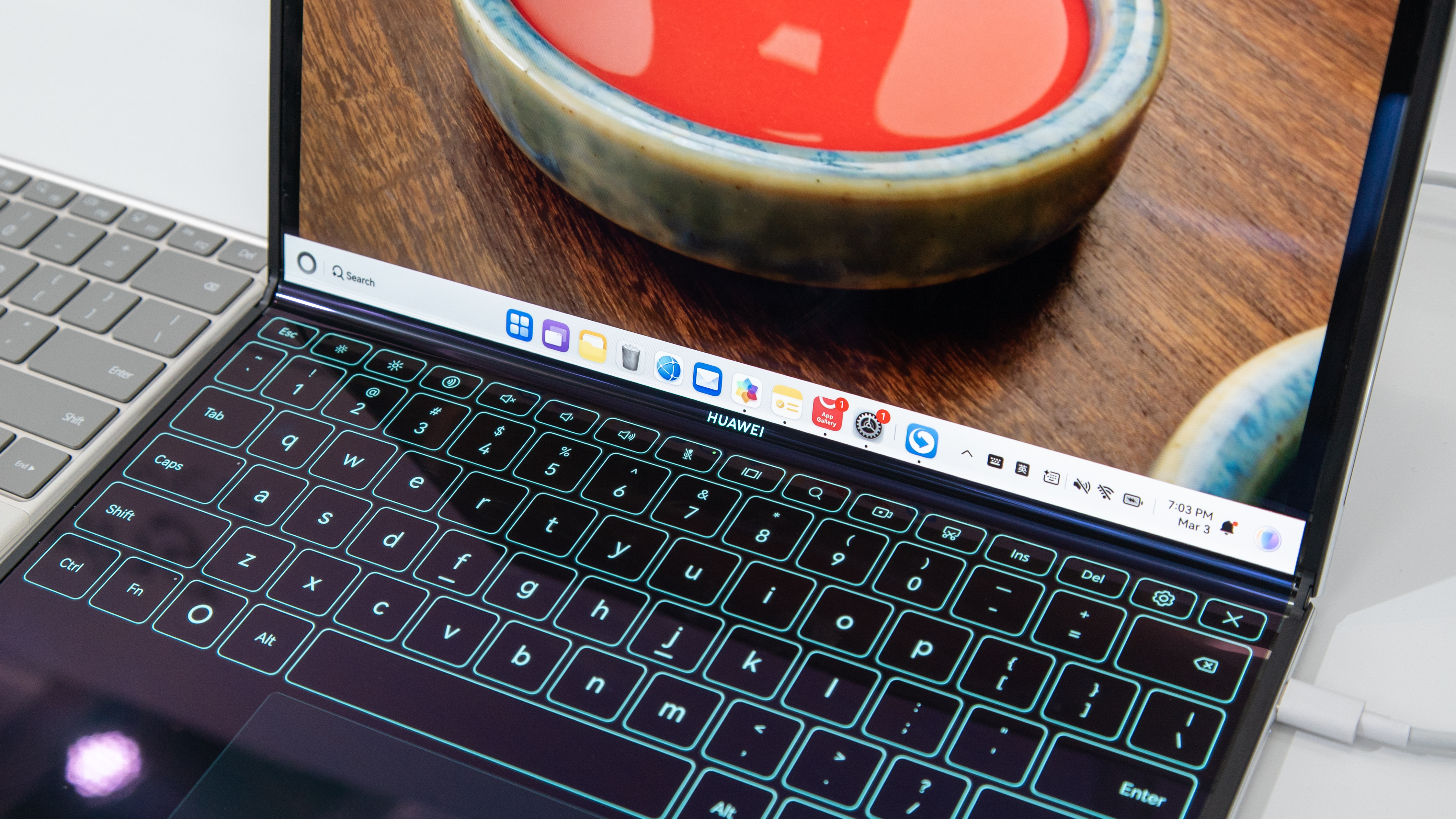 A foldable laptop with the bottom half as a touch keyboard