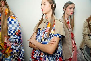 Models wearing patterned clothes and modern hairstyles