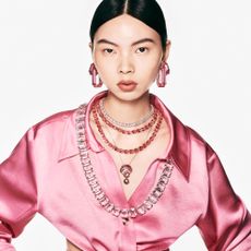 Model wearing pink Swarovski jewellery