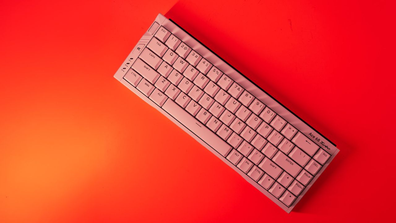 The Mchose Ace 68 Turbo on a red background.
