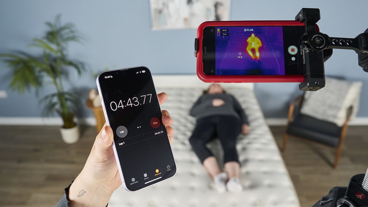 Two testers conduct a thermal imaging test to check the temperature regulation of the Saatva Classic Mattress.