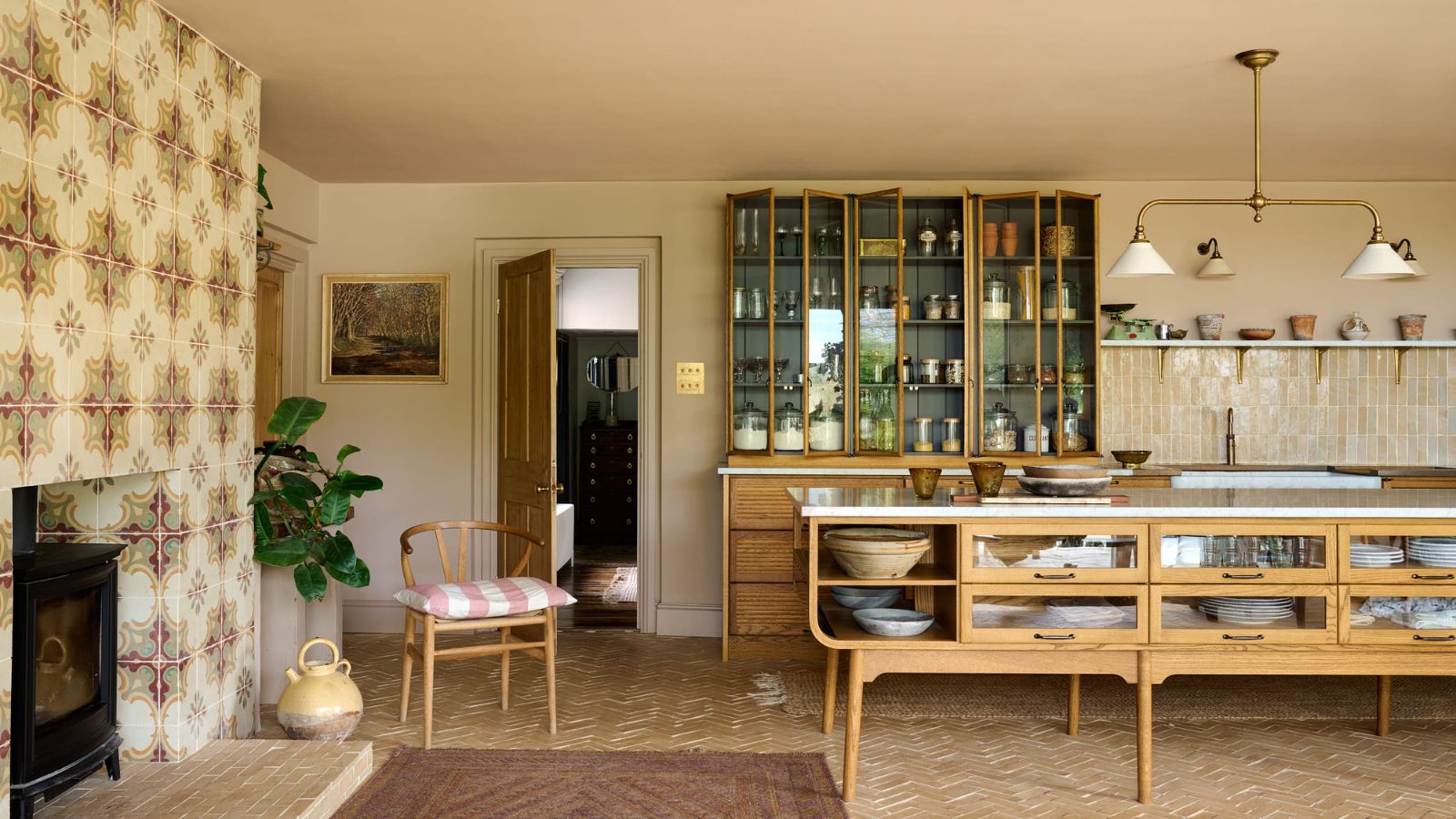 A neutral kitchen by deVOL and Bert & May with warm colors and mediterranea-style tiles
