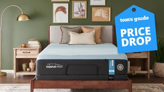 The Tempur-Pedic Tempur-LUXEbreeze mattress in a bedroom, a TOm's Guide price drop deals graphic (right)