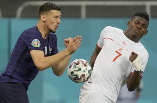 France’s Clement Lenglet and Switzerland’s Breel Embolo challenge for the ball
