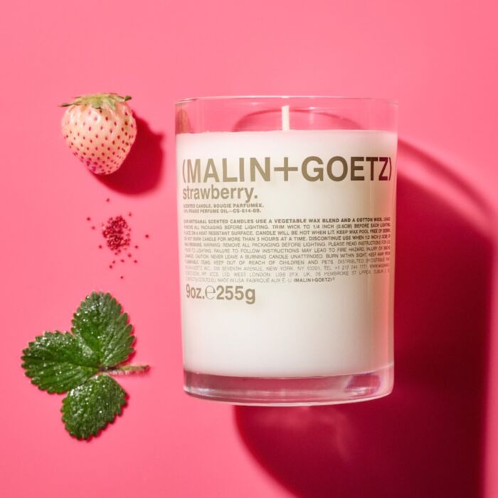 candle on pink background