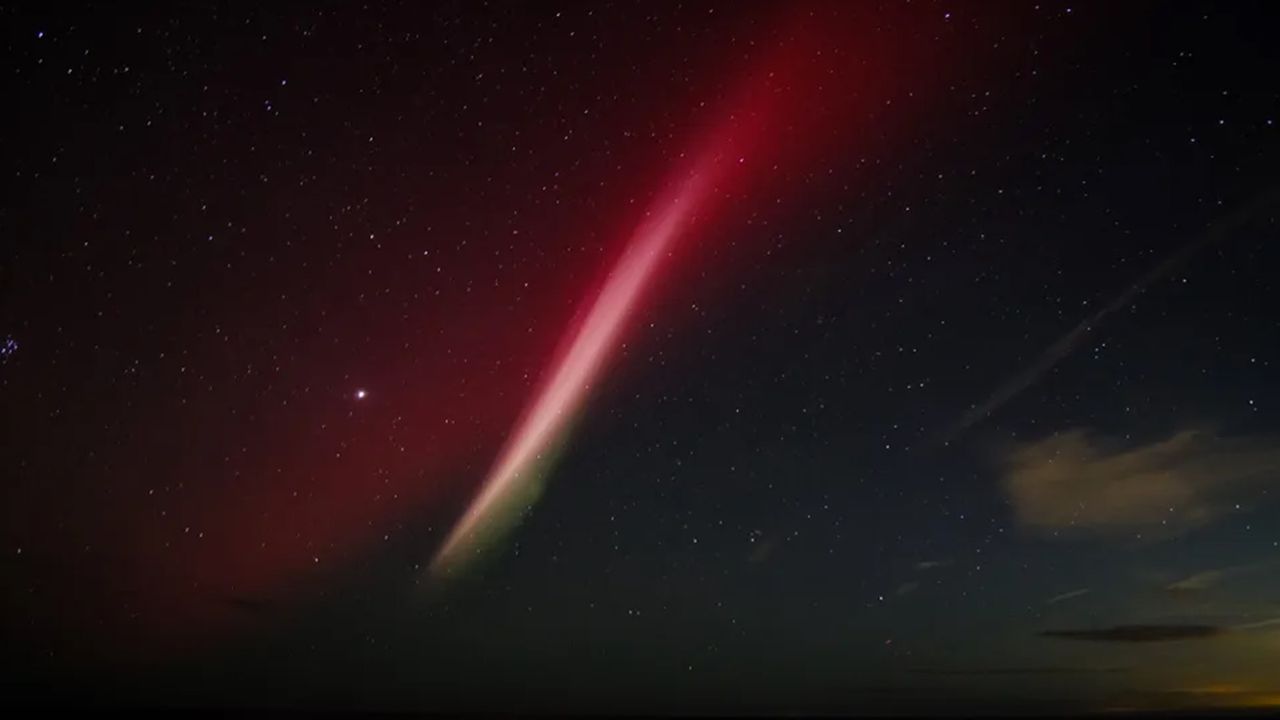 Photograph of mysterious STEVE above Dunstanburgh Castle Northumberland, UK.