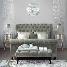 silver bedroom with upholstered sleigh bed
