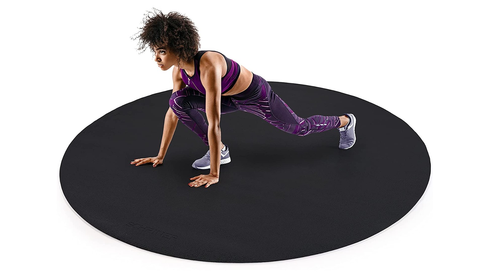 SCHRINER large round yoga mat (6 ft) with a woman practising yoga on it.