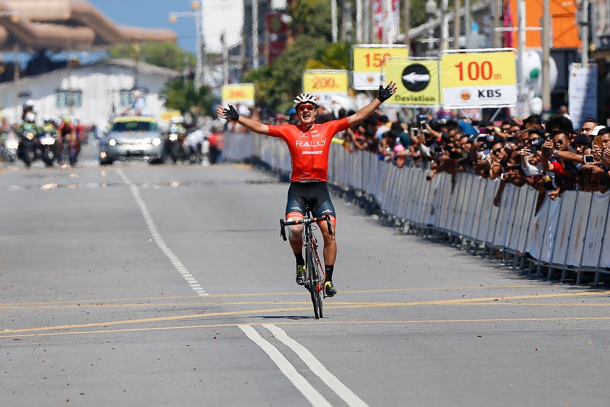 Adam De Vos celebrates his stage win in Kuala Terengganu