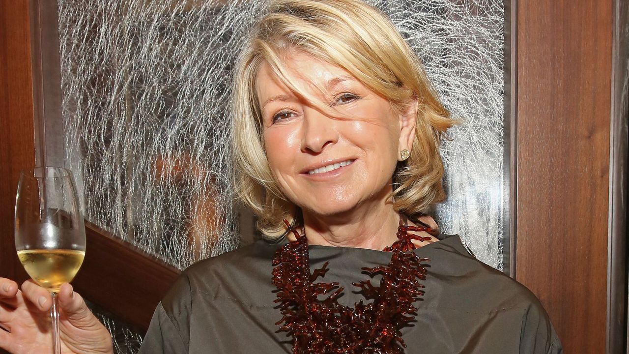 martha stewart holding up a glass of wine