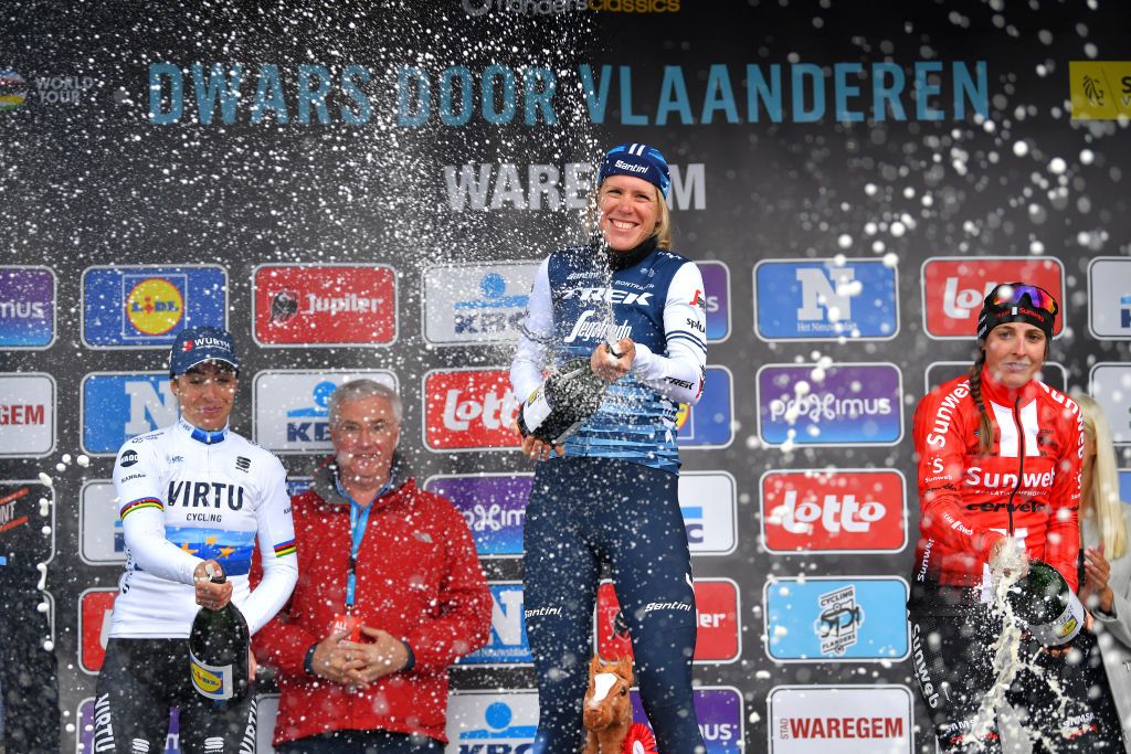 WAREGEM BELGIUM APRIL 03 Podium Marta Bastianelli of Italy and Team Virtu Cycling Ellen van Dijk of The Netherlands and Team Trek Segafredo Lucinda Brand of The Netherlands and Team Sunweb Celebration Champagne during the 8th Dwars door Vlaanderen 2019 Women Elite a 1083km race from Tielt to Waregem DwarsdrVlaander FlandersClassic on April 03 2019 in Waregem Belgium Photo by Tim de WaeleGetty Images