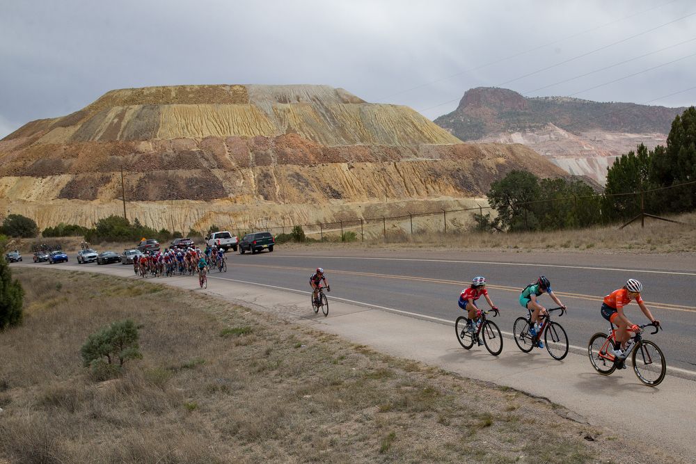 The peloton goes by the massive Santa Rita mine during stage 2