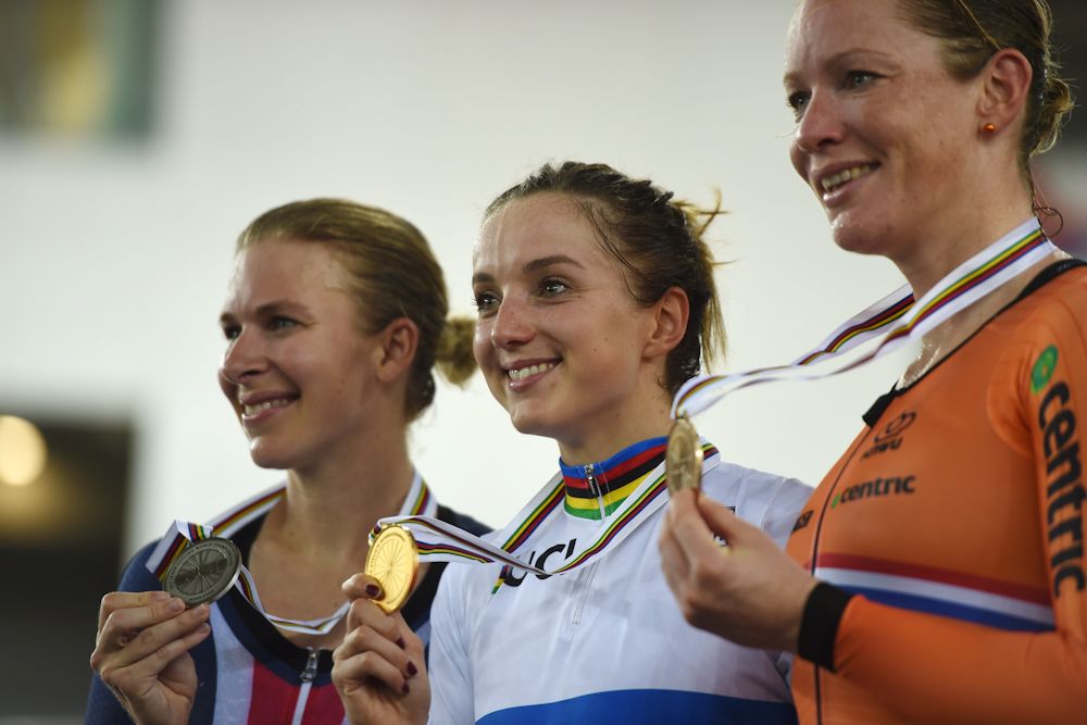 Winner Elinor Barker of Britain (C) poses with bronze medallist Kirsten Wild of the Netherlands (R) and silver medallist Sarah Hammer of the US after the women's points race final at the Hong Kong Velodrome during the Track Cycling World Championships