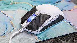 HyperX Pulsefire Haste 2 gaming mouse with grip adhesives