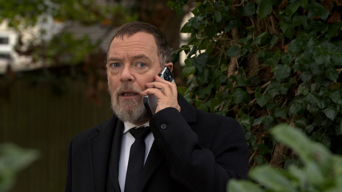 EastEnders Ian Beale on the phone at Dot Branning&#039;s funeral