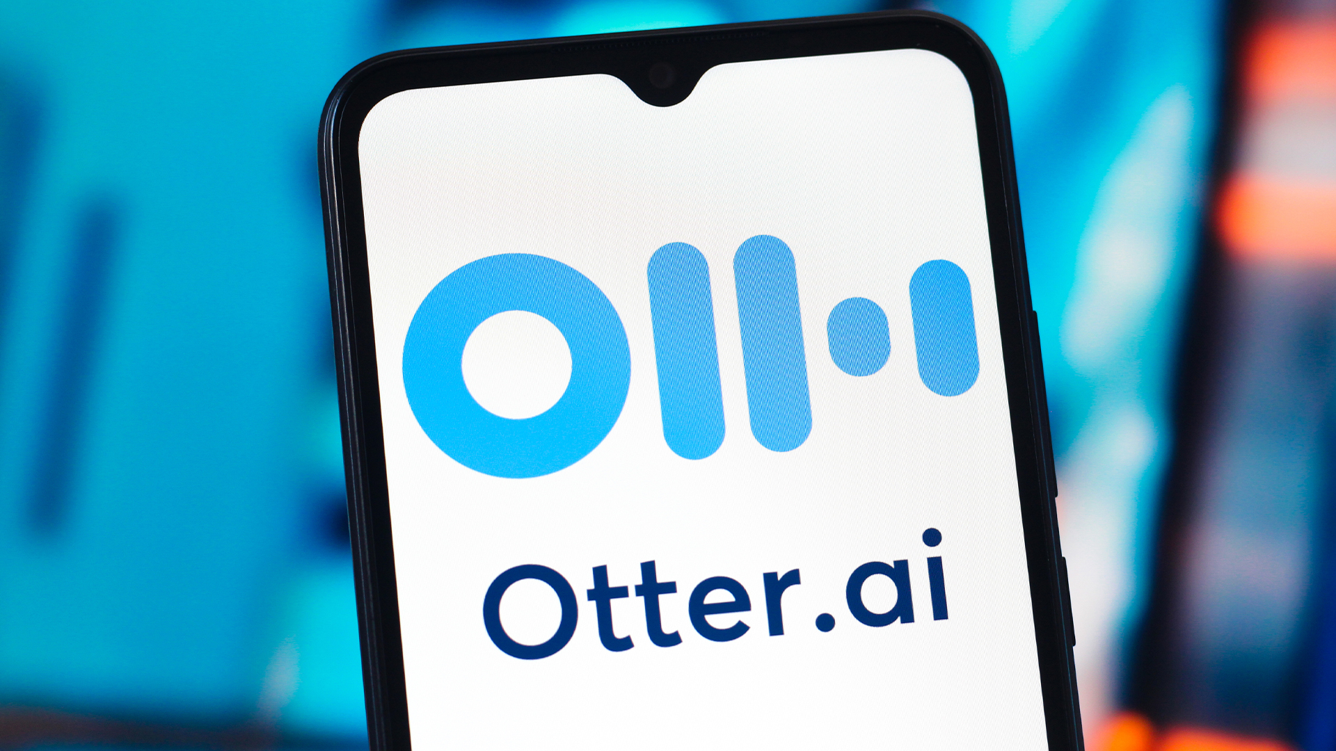 Logo and branding of Otter.ai pictured on a smartphone screen..