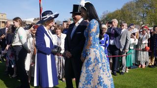 Camilla, Queen Consort speaks with Lionel Richie and Lisa Parigi