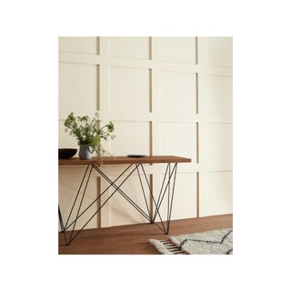 warm off-white panelling with console and plant