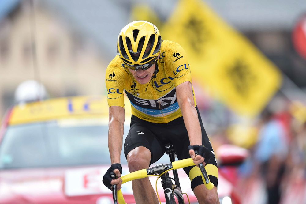 Chris Froome crosses the finish line of stage 19