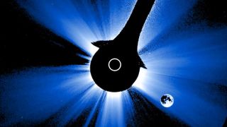 coronagraph view of the moon in the lower right corner and the sun in the center with the central disk blocked so only the outer corona is visible.