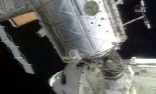 Casting Off: Shuttle Discovery Undocks from Space Station