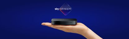 The Sky Stream held in the palm of a hand, with the Sky Stream logo above it, on a blue/purple background