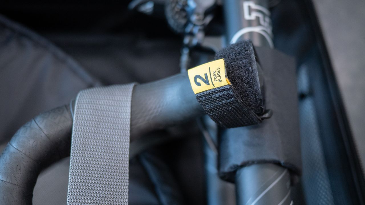 Topeak Pakgo X Bike Carrier controls tied to fork