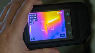 FLIR C5 thermal imaging camera in hand