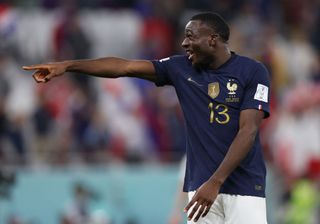 Youssouf Fofana of France celebrates after the FIFA World Cup Qatar 2022 Round of 16 match between France and Poland at Al Thumama Stadium on December 04, 2022 in Doha, Qatar.