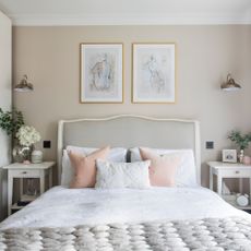 White bedroom with pictures