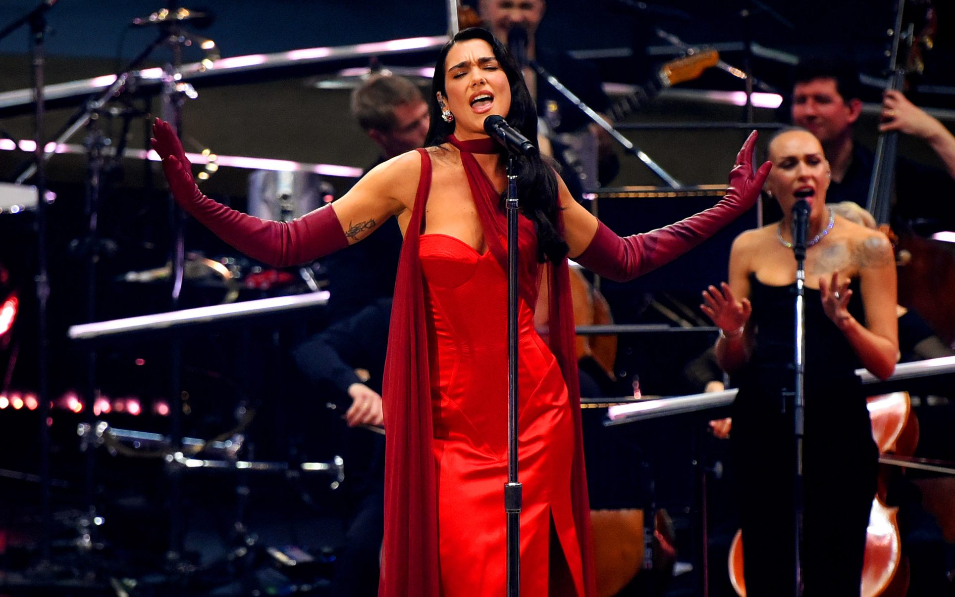 Dua Lipa Pours Herself Into A Cherry Red Corset Gown At Her Intimate 